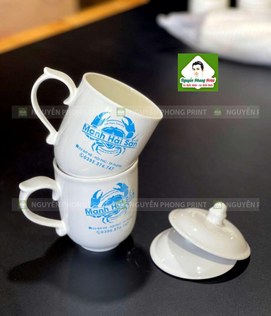 Ly sứ trắng Minh Châu kèm nắp in logo quà tặng